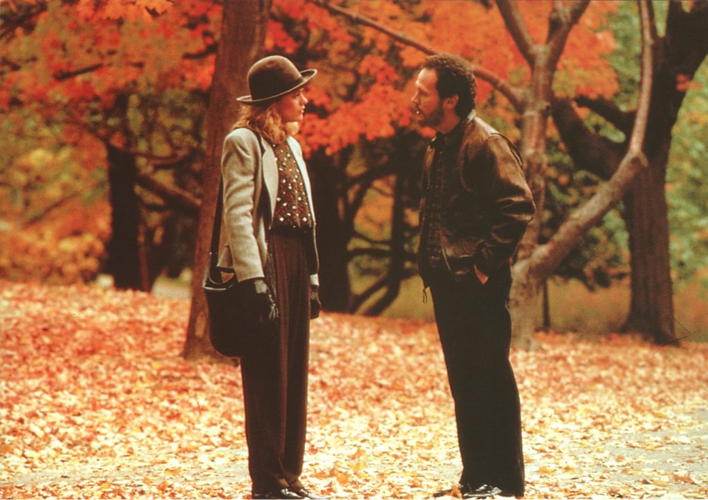 Harry and Sally walking through the fall foliage. 